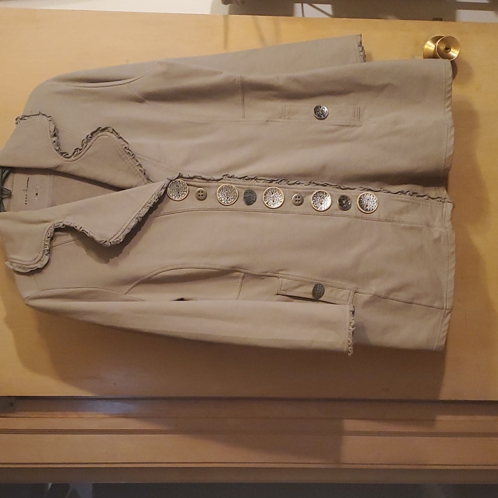 Taupe color jacket for a light weather day.